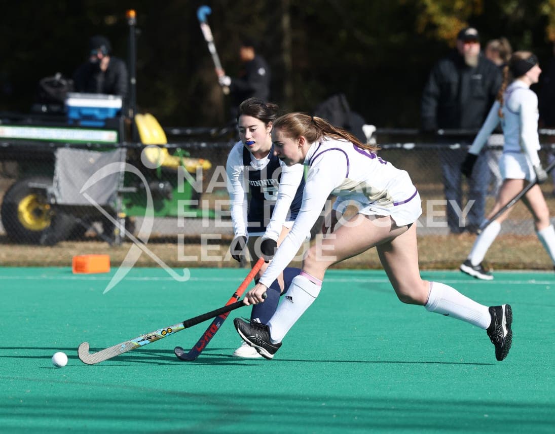 Two JMU players chasing the ball