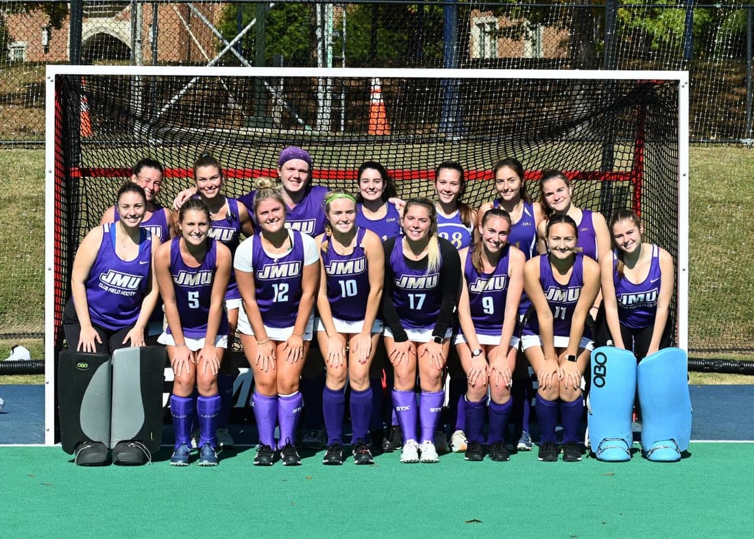 Team in purple in front of the goal